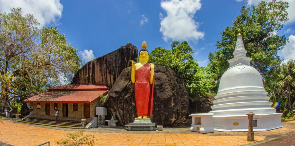 Buddhist temple with giant Buddha statue in Unawatuna, Southern Sri Lanka, a popular spiritual site.